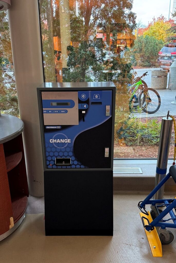 Change machine supplied and installed in a building lobby