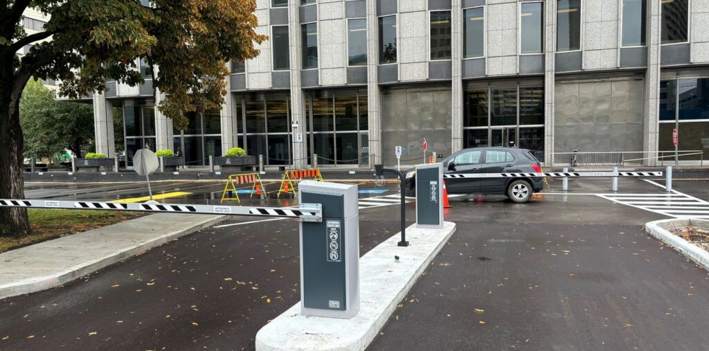 Barrier gate arms at the entry and exit lanes of a commercial office site